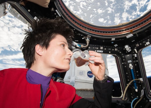 Samantha Cristoforetti drinks coffee in the Space Station Cupola
